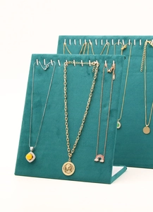 L-shaped dark green microfiber necklace display board with hooks for jewelry presentation