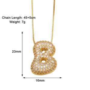 Detailed view of gold letter B pendant necklace with zircon paving and size dimensions