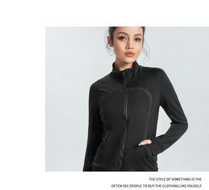 Detail of slim-fit black yoga jacket featuring stand collar and pleated front design