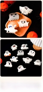 Close-up of Halloween ghost hair clips in various expressions and glitter finishes