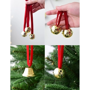 Golden Christmas iron bells with red velvet ribbons displayed on a festive Xmas tree