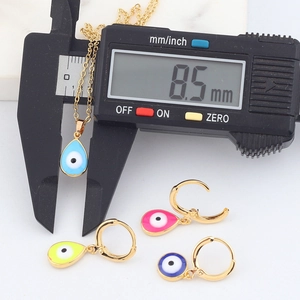 Detailed view of 8.5mm teardrop evil eye jewelry set with colorful enamel and gold finish