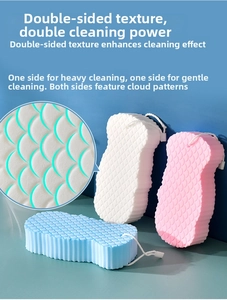 Close-up of double-sided textured bath sponge showing 3D fish scale pattern for exfoliation