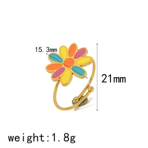 Detail view of adjustable gold ring with colorful enamel flower and size measurements