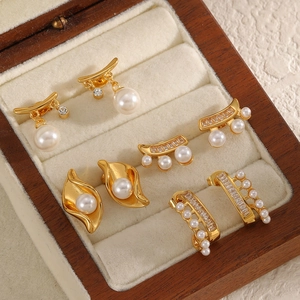 Elegant gold stainless steel pearl earrings collection in premium wood jewelry box