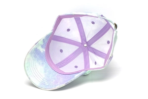 Detail view of colorful tie-dye baseball cap with adjustable metal strap and mesh lining