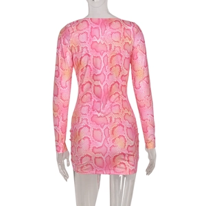 Back view of a pink snake print bodycon mini dress with long sleeves on a clear mannequin