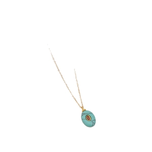 Oval turquoise pendant necklace with red zircon center on a gold stainless steel chain