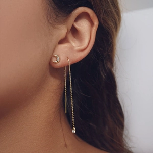 Detail of S925 silver moon stud and long chain tassel earring with cubic zirconia