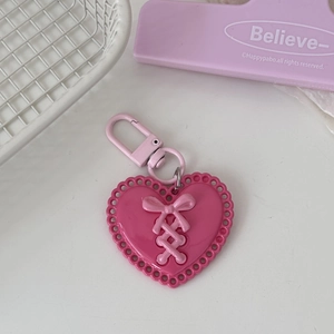 Pink Y2K heart keychain with ribbon bow detail and matching metal D-ring buckle