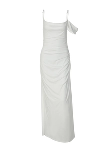 Close-up of the elegant white satin texture and asymmetric neckline of the dress