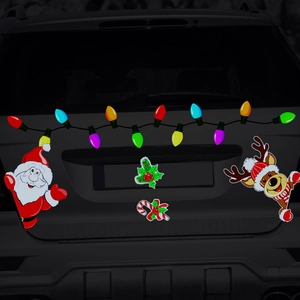 Reflective Santa and reindeer magnetic decals applied on black car trunk for Christmas