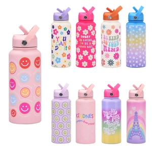Close-up of macaron colored stainless steel bottles with motivational quotes and straws