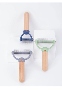 Detail of pet de-matting comb featuring stainless steel teeth and beech wood handle