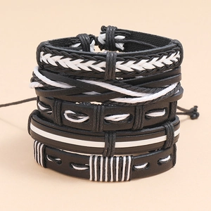 Stack of vintage woven leather bracelets in black and white styles for a layered look
