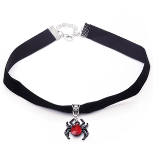 Gothic black velvet choker featuring a detailed spider pendant with a red gemstone