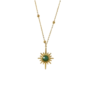 Classic 14K gold-plated stainless steel necklace with green stone starburst pendant