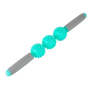 Close-up of a three-ball muscle massage roller with textured spikes for deep tissue relief