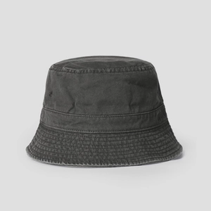 Detail view of washed cotton fabric texture and parallel stitching on a bucket hat brim