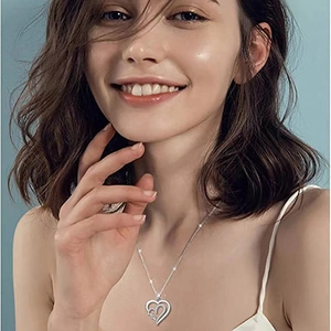 Silver double heart MOM pendant necklace with sparkling small diamonds on model