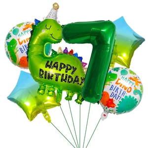 Detail view of 7th birthday dinosaur party kit with green foil balloons and stars