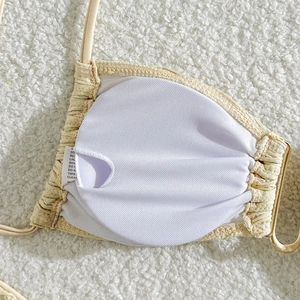 Detail of ribbed bikini cup with breathable mesh lining and gold metal ring link
