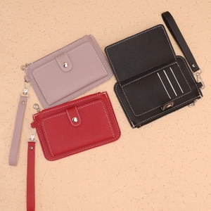 Three minimalist faux leather coin purses in pink, red, and black with lanyard and card slots