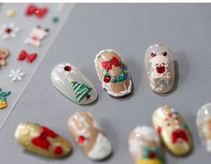 Macro shot of 5D Christmas nail stickers with 3D embossed trees, reindeer and wreaths