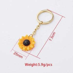 Polished yellow sunflower pendant keychain with gold chain and size measurements