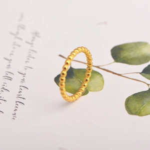 Elegant gold beaded minimalist bubble ring on white art card for women's fashion jewelry