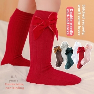 Detail of 6-color set baby knee-high ribbed socks with velvet bow for ages 0-3