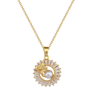 Elegant gold leaf pendant necklace with white pearl and rectangular zircon accents