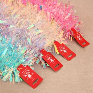 Iridescent Christmas tinsel garland with snowflake sequins for holiday tree decoration