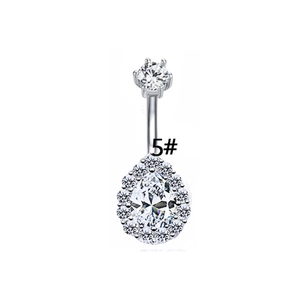 Detail of silver belly ring featuring a teardrop zircon stone with halo setting