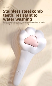 Détail des poils en acier inoxydable de 0,45 mm sur une brosse pour chat en forme de patte