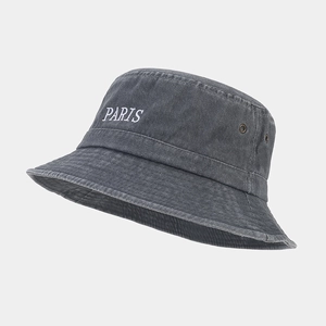 Detail of PARIS embroidery and metal eyelets on vintage washed cotton bucket hat