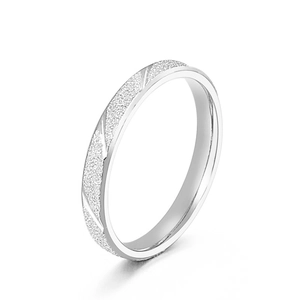 Minimalist matte stainless steel ring with diagonal polished stripes on white background
