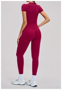 Rear view of women's burgundy high-waisted yoga set featuring slim fit compression fabric