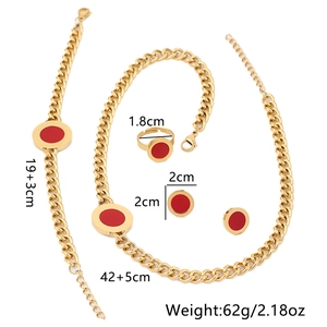 Golden stainless steel jewelry set with red circular charms including necklace and earrings