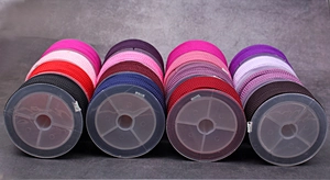 Close-up of 2mm colorful pineapple cords for DIY jewelry on organized spools