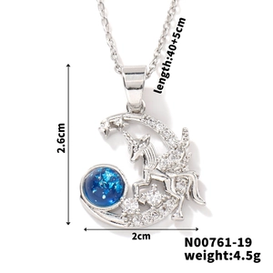 Detailed view of unicorn on crescent moon pendant with size and weight dimensions