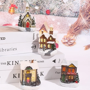 Set of 4 glowing Christmas village resin houses with fire station and snowy church decor