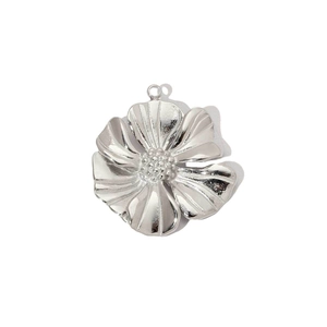 Detailed view of silver flower pendant with textured petals and granulated center
