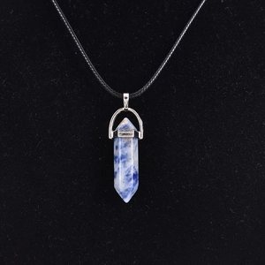 Polished blue sodalite hexagonal point pendant necklace with black cord and silver mount