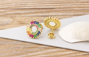 Detail of sunflower stud earrings featuring multi-color zircons on gold-plated base
