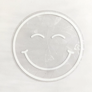 Close-up of translucent rainbow suncatcher window sticker with smiley face and texture