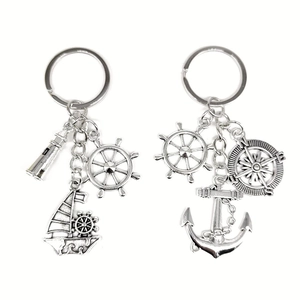 Vintage nautical silver keychains with sailboat lighthouse compass and anchor charms