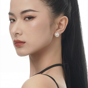 Elegant irregular silver freshwater pearl stud earrings for women on model