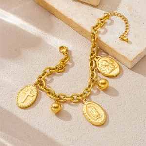 Gold vintage stainless steel coin pendant necklace and bracelet set on stone base