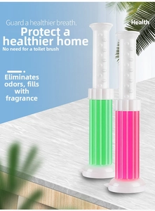 Macro detail of toilet cleaning gel tubes in pink and green for odor removal